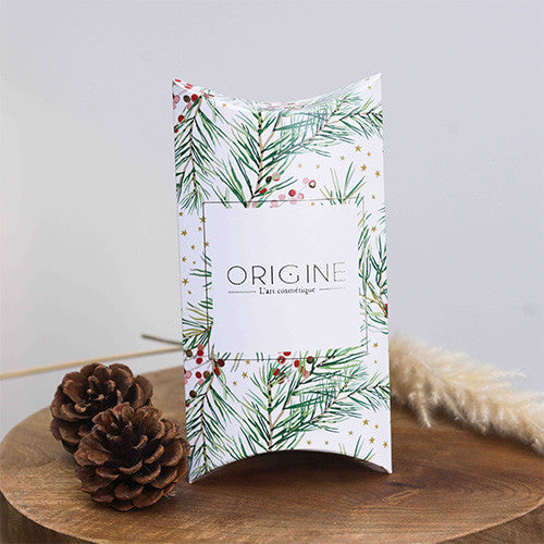 Coussin de présentation au motif de Noël pour coffret de formats voyage, Origine